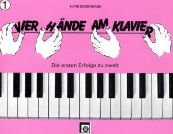 Vier Hände am Klavier