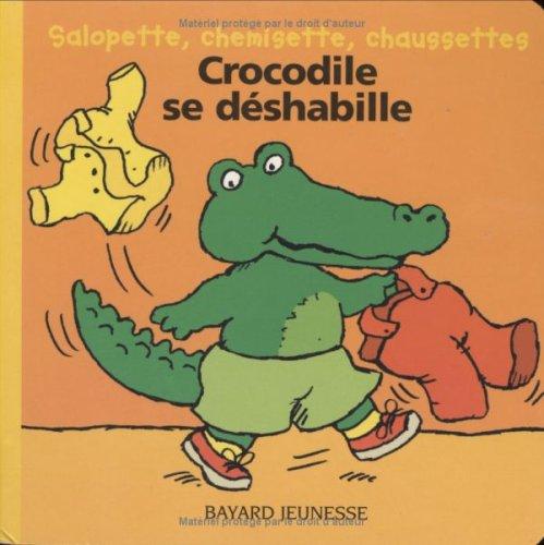 Crocodile se déshabille : salopette, chemisette, chaussettes